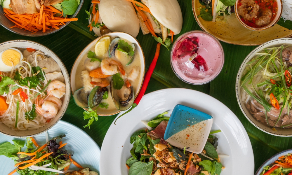 Table with a great diversity of Vietnamese food.